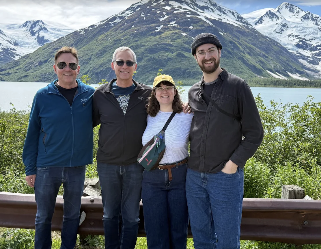 Happy guests by a glacier lake